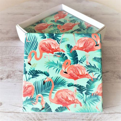 Introduce a touch of the tropics to your home with our Flamingo Tropical Coasters! Featuring a vibrant flamingo design, these coasters are perfect for protecting your table surfaces while adding a pop of color to any room. This boxed set of 4 makes for a great kitchen gift, or simply treat yourself to some fun and functional decor.  Quality ceramic | 10 x 10 cm | Cork non slip backing | White gift box with lid | Set of 4 ( same design ) Glossy finish.