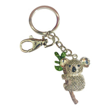 Load image into Gallery viewer, The koala is one of the world’s most iconic animal species – And they&#39;re found nowhere else in the world but Australia!  Our adorable handmade koala is the perfect Australian gift, for koala lovers and tourist worldwide.  Koala 4 x 5.5 cm | Assorted rhinestone colours | Silver metal | Full length of keychain 12cm | Come&#39;s in a beautiful organza cotton bag - colours may vary.