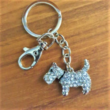 Load image into Gallery viewer, Our teeny tiny super cute mini Scottish terrier keychain is the perfect little gift for Scottish terrier lovers. Silver metal keychain - full length 10 cm | Scottish terrier 3 x 4 cm | Silver rhinestones | Hand painted black eyes &amp; collar | Come in cotton organza gift bag - colours may vary.  We have something for everyone - view our full range of gifts, Keychains &amp; Gifts Australia.