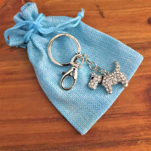 Our teeny tiny super cute mini Scottish terrier keychain is the perfect little gift for Scottish terrier lovers. Silver metal keychain - full length 10 cm | Scottish terrier 3 x 4 cm | Silver rhinestones | Hand painted black eyes & collar | Come in cotton organza gift bag - colours may vary.  We have something for everyone - view our full range of gifts, Keychains & Gifts Australia.