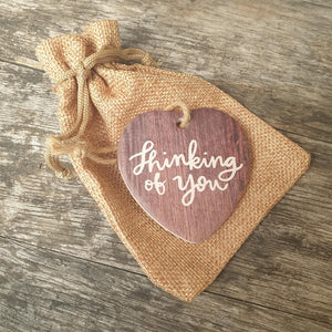 This small ceramic heart makes for the perfect thinking of you gift. With a delicate organza bag and rope hanger, it's a thoughtful and heartfelt gesture. Show your loved one you care with this charming and meaningful gift.
