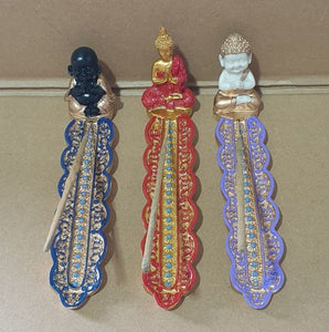 Set of 3 | Resin | Baby Buddha gold, white & purple | Thai Buddha red, gold, blue | Jolly Buddha black, gold & blue | Average length 18 cm | Average height 5 cm | Average width 4 cm | Boxed individually | Incense stick not included - only for photo purpose.